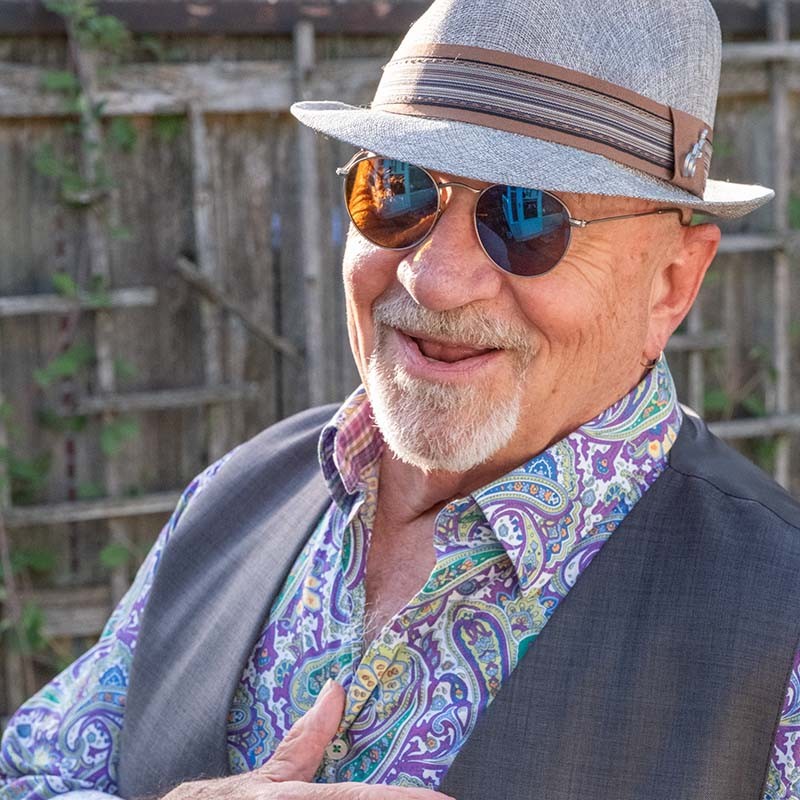 Derrick Procell wearing a grey hat and sunglasses, photographed for the promotion of My Incredible Heart.