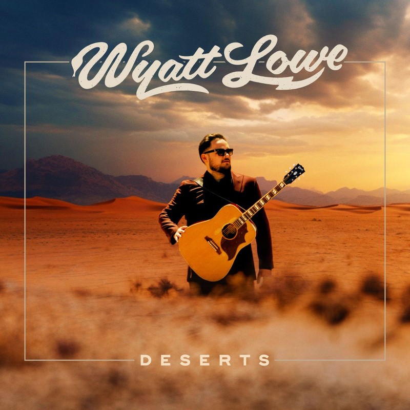 Album cover of Deserts by Wyatt Lowe, showing the guitarist with an acoustic guitar in a desert landscape at sunset.